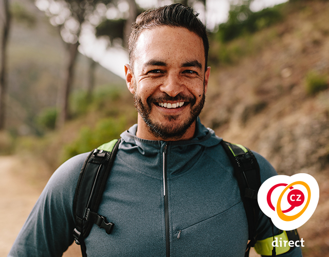 Man smiling and hiking